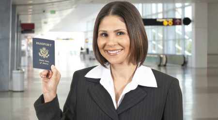 woman-holding-passport-in-airport